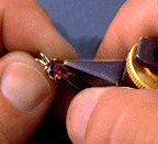 Bend the Prong onto the Gem